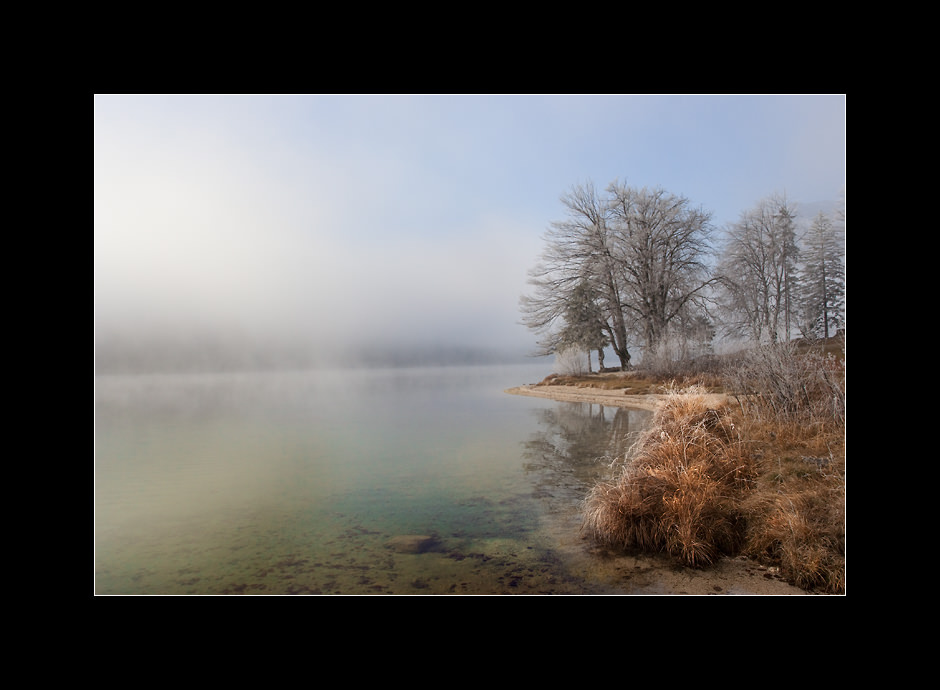 Frosty and foggy morning on Bohinj lake, Julian alps, Slovenia.