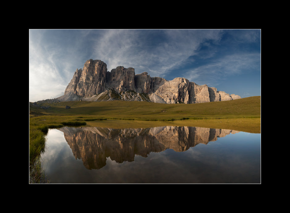 Reflection of Lastoni di Formin massif in calm waters of Lago delle Baste, Dolomiti Ampezzane, Italy.